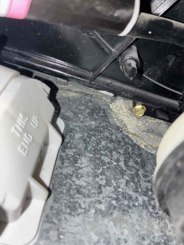 Performed a heating system tune-up, including inspection and cleaning of the blower assembly, where light dust and debris buildup was found on the blower wheel blades with no cracking, rust, or damage. Inspected the cabinet interior and noted staining and crusty residue around a brass fitting in the base pan, indicating possible past moisture or sealant leakage that should be monitored. Performed a heating system tune-up, including inspection and cleaning of the blower assembly, where light dust and debris buildup was found on the blower wheel blades with no cracking, rust, or damage. Inspected the cabinet interior and noted staining and crusty residue around a brass fitting in the base pan, indicating possible past moisture or sealant leakage that should be monitored.