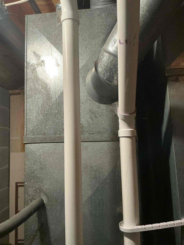 Performed an on-site evaluation for replacement of an existing forced-air HVAC system, inspecting the furnace/air handler cabinet, supply plenum and ductwork, condensate drain piping, and installation area. Documented existing conditions, including cabinet and duct wear, efflorescence and staining on the concrete slab indicating prior moisture exposure, and unit clearance measurements (approximately 33 inches) to determine sizing and installation requirements. Reviewed AC replacement options for the customer and noted site conditions to be addressed prior to installation. Performed an on-site evaluation for replacement of an existing forced-air HVAC system, inspecting the furnace/air handler cabinet, supply plenum and ductwork, condensate drain piping, and installation area. Documented existing conditions, including cabinet and duct wear, efflorescence and staining on the concrete slab indicating prior moisture exposure, and unit clearance measurements (approximately 33 inches) to determine sizing and installation requirements. Reviewed AC replacement options for the customer and noted site conditions to be addressed prior to installation.