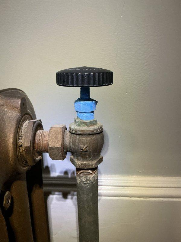 Replaced a failed radiator valve handwheel (knob) on the cast-iron steam/hot water radiator at the customer's request, restoring manual operation of the valve. The valve stem, packing nut, and union fitting were inspected, and the existing valve assembly was left in service. System operation was verified, and the thermostat was observed operating normally in heat mode. Replaced a failed radiator valve handwheel (knob) on the cast-iron steam/hot water radiator at the customer's request, restoring manual operation of the valve. The valve stem, packing nut, and union fitting were inspected, and the existing valve assembly was left in service. System operation was verified, and the thermostat was observed operating normally in heat mode.