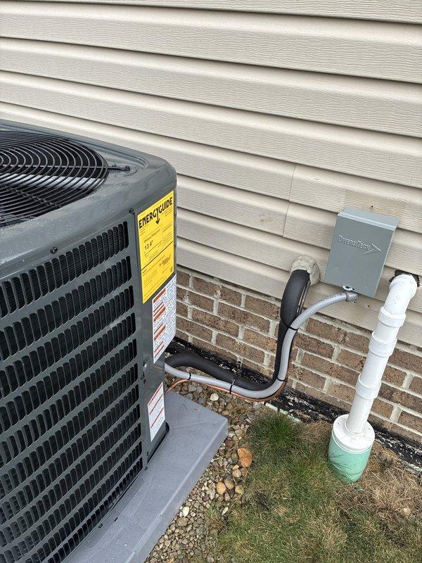 Installed a complete high-efficiency HVAC system consisting of a 96% AFUE gas furnace, a Goodman air conditioning condenser, and a whole-home humidifier. The condenser was set level on a composite pad with a new insulated refrigerant line set, flexible electrical conduit, a fused disconnect, and a PVC condensate drain routed to code. The system was verified for proper operation, and the installation was left clean with no visible damage. Installed a complete high-efficiency HVAC system consisting of a 96% AFUE gas furnace, a Goodman air conditioning condenser, and a whole-home humidifier. The condenser was set level on a composite pad with a new insulated refrigerant line set, flexible electrical conduit, a fused disconnect, and a PVC condensate drain routed to code. The system was verified for proper operation, and the installation was left clean with no visible damage.