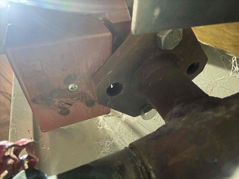 Responded to a reported boiler leak and inspected the unit's interior components, piping, and mounting hardware. Observed heavy surface rust and corrosion on the steel mounting plate, fittings, and piping, along with worn, scuffed paint and accumulated dust and cobwebs within the equipment area. Documented the conditions photographically to support leak source identification and further corrective action. Responded to a reported boiler leak and inspected the unit's interior components, piping, and mounting hardware. Observed heavy surface rust and corrosion on the steel mounting plate, fittings, and piping, along with worn, scuffed paint and accumulated dust and cobwebs within the equipment area. Documented the conditions photographically to support leak source identification and further corrective action.