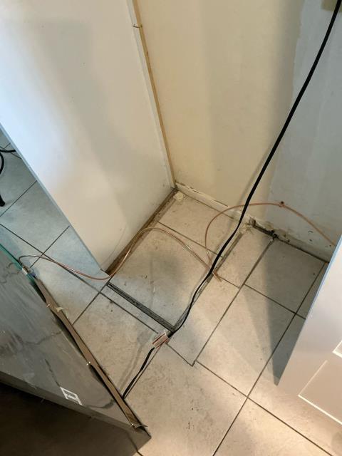 I replaced the refrigerator’s icemaker line through the cabinets and connected it underneath the kitchen sink.