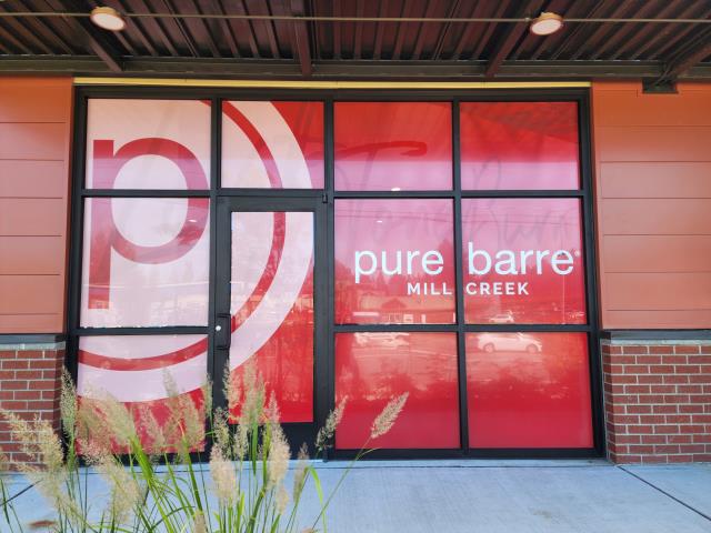 Give your storefront curb appeal that gets you notices and shows off your brand! Check out these perforated window graphics and wall graphics we printed and installed for Pure Barre of Mill Creek!  .  .  .  #wallgraphics #wallwraps #WindowGraphics #Stickers #Sticker #Design #SmallBusiness #Business #Promotion #Marketing #Branding #vinylgraphics #windowwraps #diecutgraphics #vinyllettering #signage #perforatedvinyl #storefronts