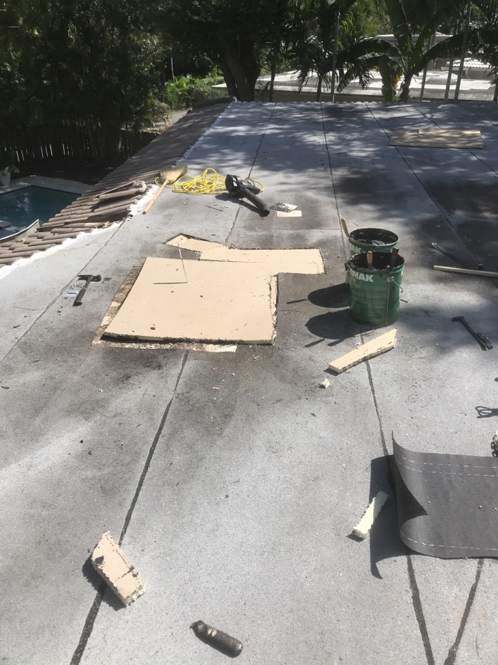 Checking a re-pair in Miami Shores on flat deck Checking a re-pair in Miami Shores on flat deck