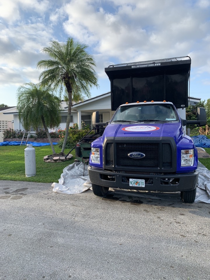 Tile reroof tear off in progress in Tamarac Tile reroof tear off in progress in Tamarac