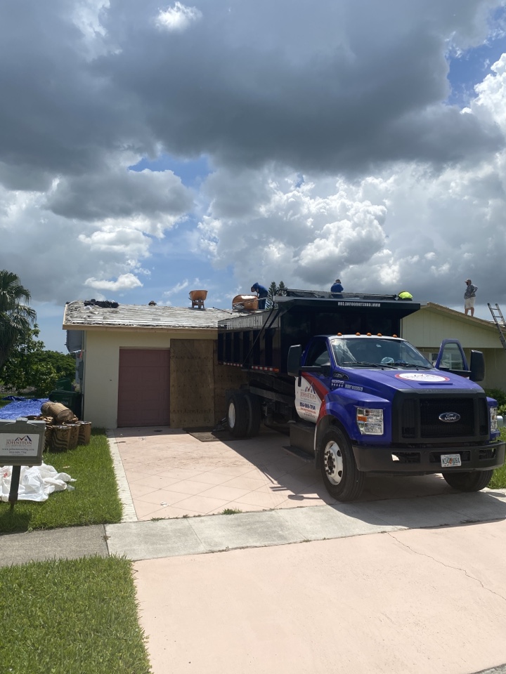 Margate, FL - Roof replacement removing roof tiles installing roof tiles. Margate, FL - Roof replacement removing roof tiles installing roof tiles.