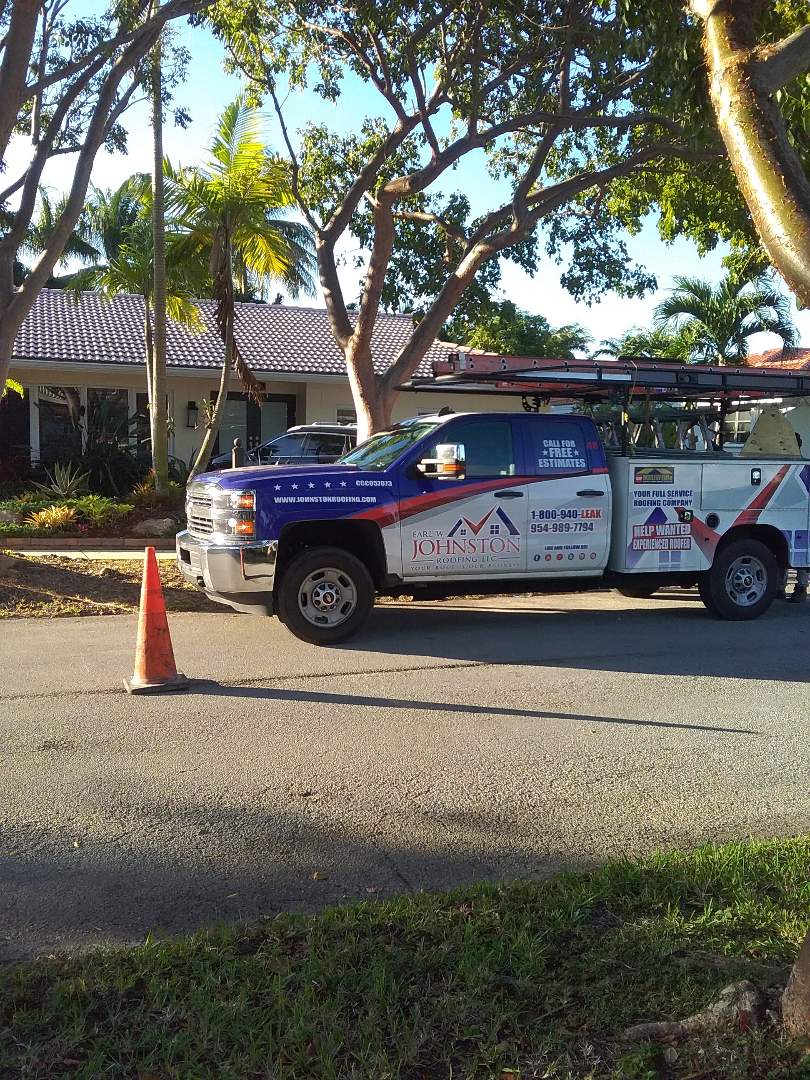 Roof tile repair in the city of Miami Florida this repair is being done by Earl W Johnston roofing company Tony and Darnell are you repair technicians Roof tile repair in the city of Miami Florida this repair is being done by Earl W Johnston roofing company Tony and Darnell are you repair technicians