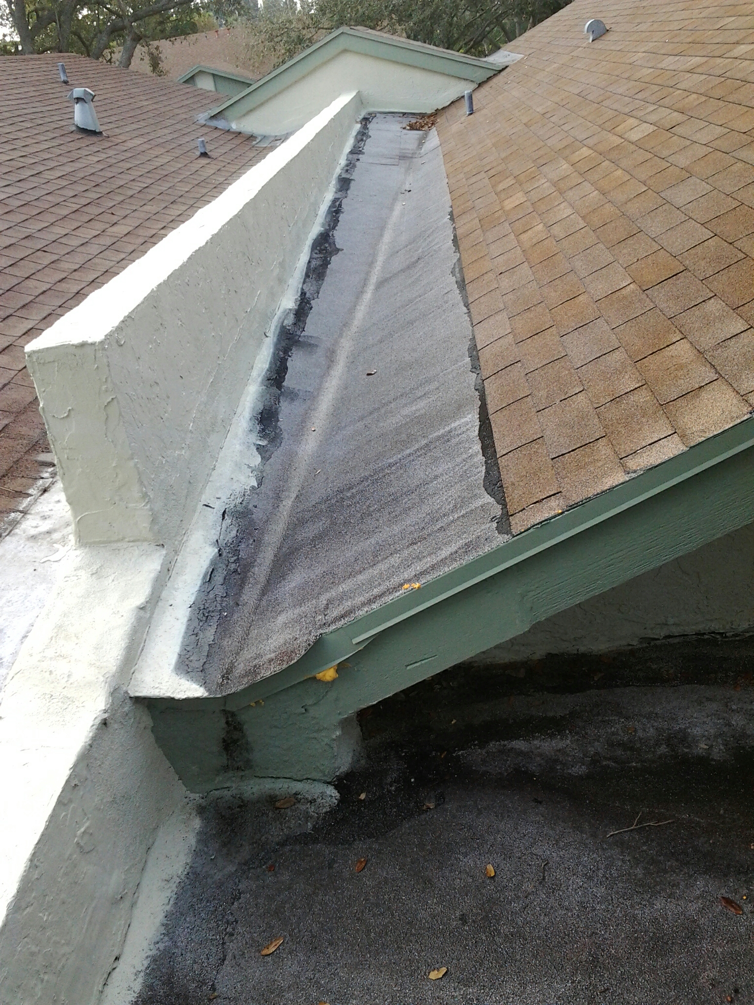 Delray Beach, FL - Mike and Earl Johnston roofing doing repairs to shingle roof..crickets..flat roof. Delray Beach, FL - Mike and Earl Johnston roofing doing repairs to shingle roof..crickets..flat roof.