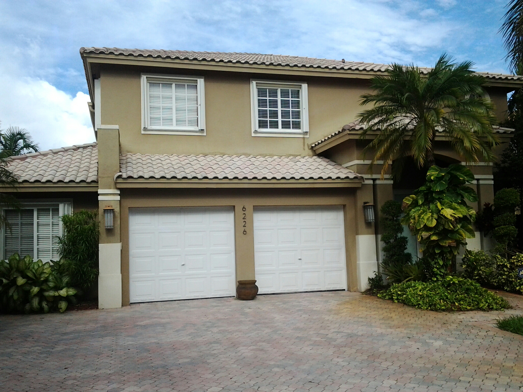 Doral, FL - Brandon and Garry applying roof a cide to roof Doral, FL - Brandon and Garry applying roof a cide to roof