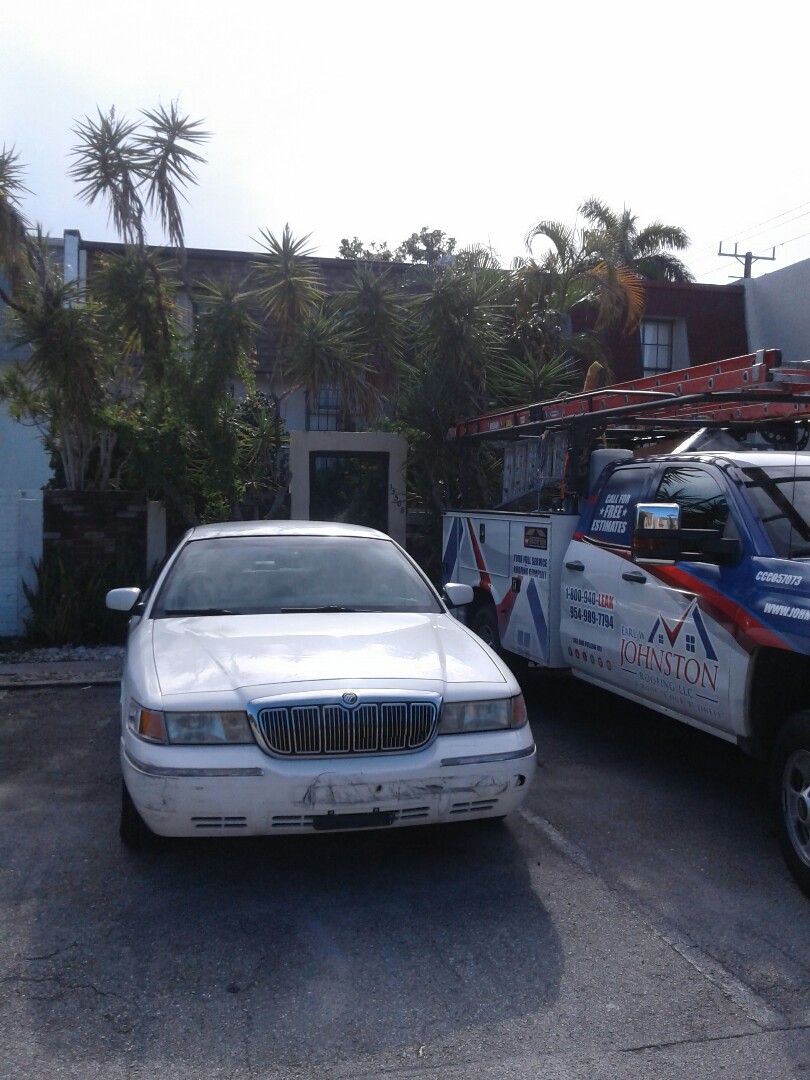 North Miami, FL - Roof repair in the city of Miami Florida this repair is being done by Earl W Johnston roofing company Tony and Adam are your repair technicians North Miami, FL - Roof repair in the city of Miami Florida this repair is being done by Earl W Johnston roofing company Tony and Adam are your repair technicians