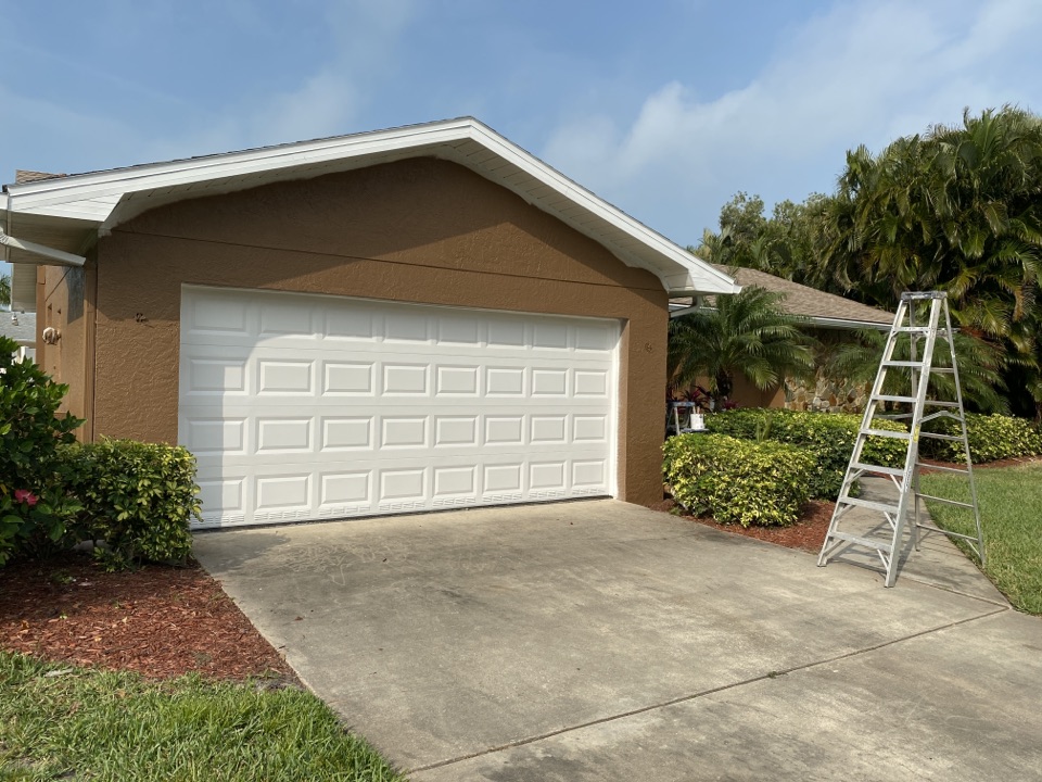 Residential exterior paint project by Premier Painting & Coating. Trim is painted and working on finishing up the body. 