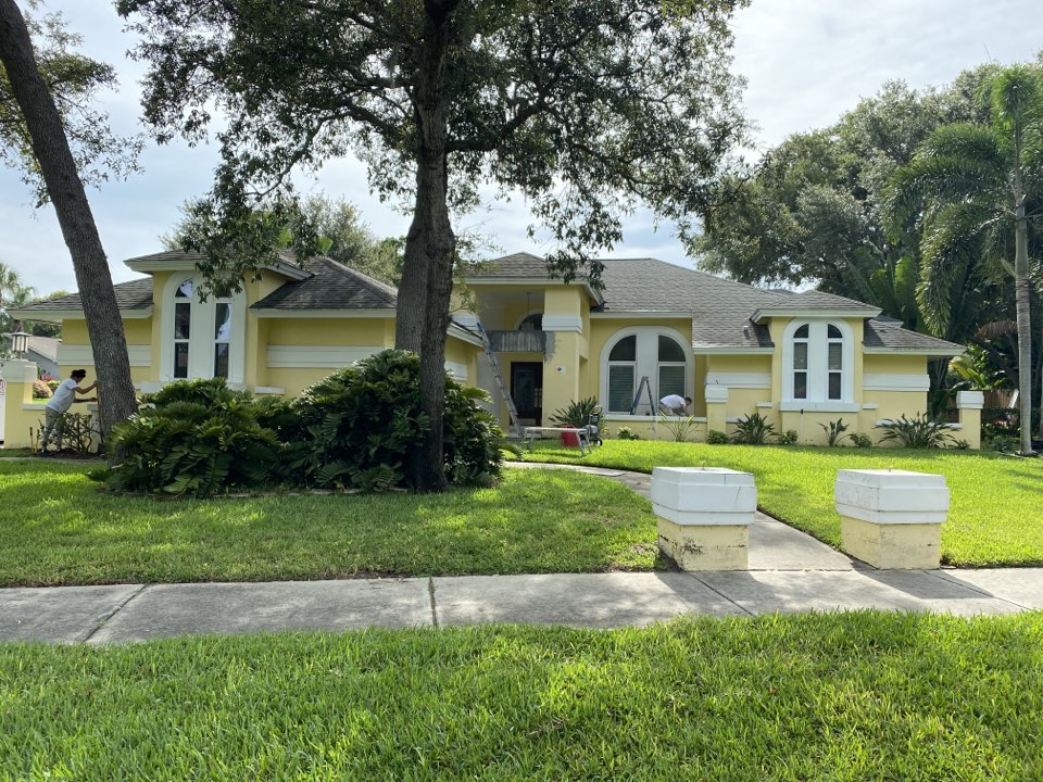 Residential exterior repaint by Premier Painting & Coating. Starting with pressure washing the entire exterior before moving on to prep and paint. 