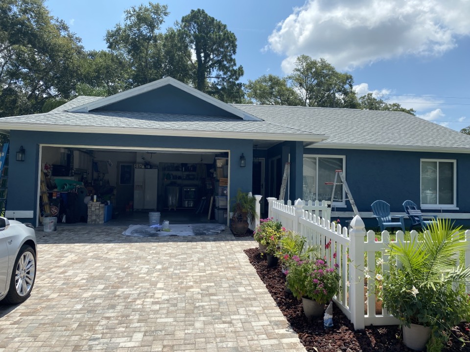 Exterior residential paint project by Premier Painting & Coating. Let touch ups before house is complete and move on to pool cage. 