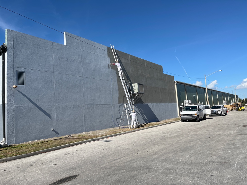 Hot stucco primer before we paint this commercial exterior with Premier Painting and Coating call for your free estimate interior exterior residential or commercial  (727)440-9393