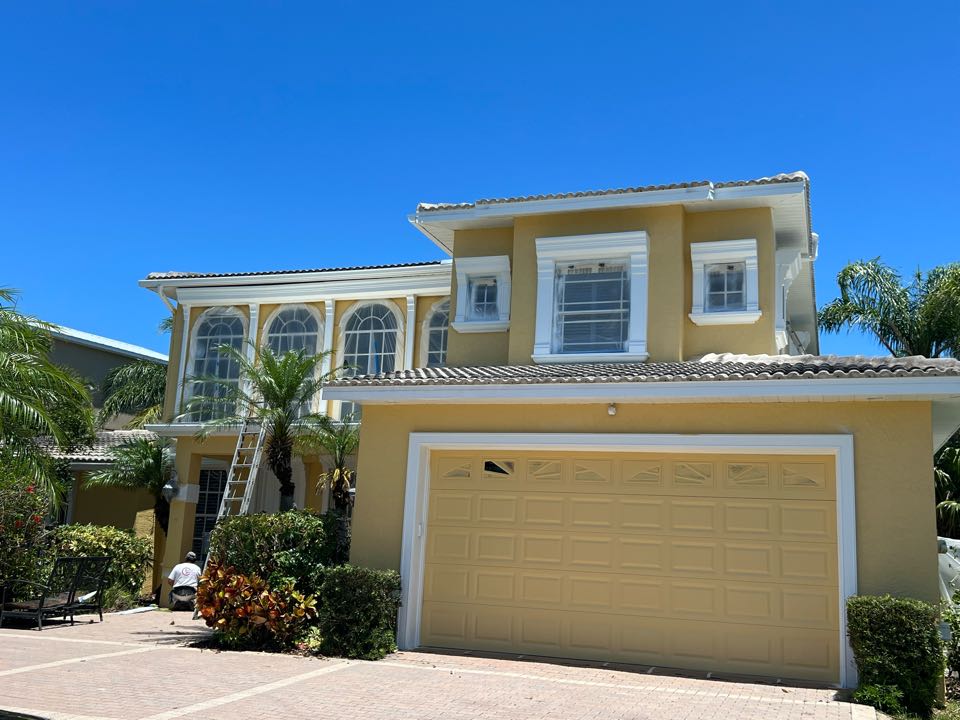 This Redington Beach waterfront home is getting a gorgeous new exterior painting and staining.Stucco repairs were first and now the home is almost done!