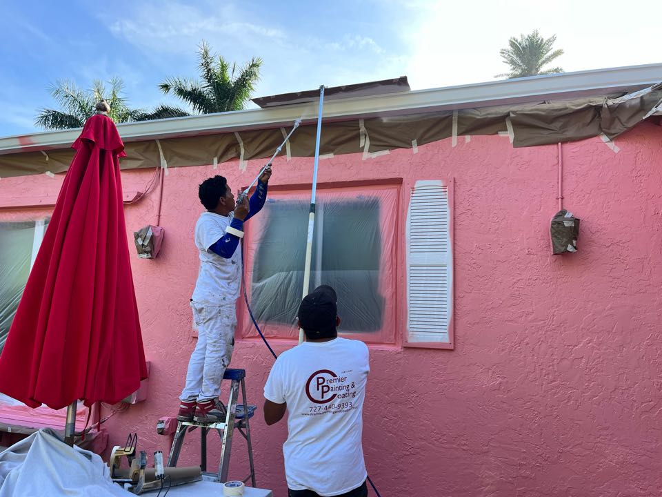 Teamwork makes the dream work finishing up the trim on this full exterior repaint with Premier Painting And Coating call for your free estimate (727)440-9393 interior, exterior, residential, or commercial