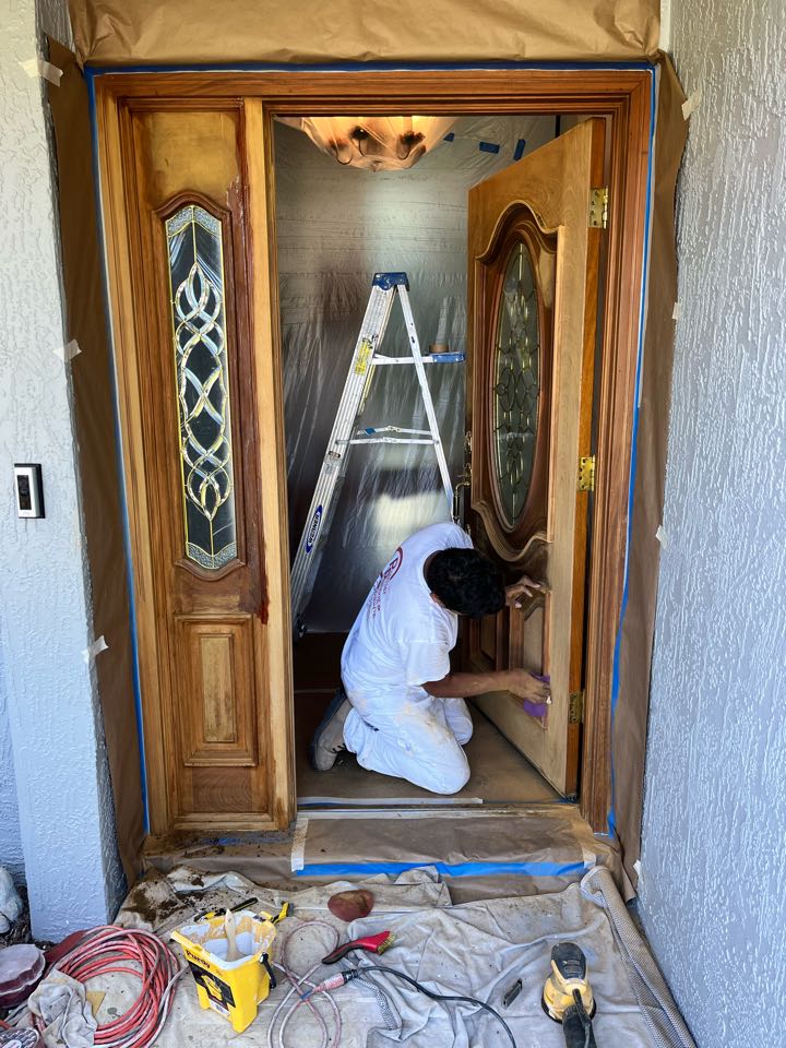 In the process of stripping this entrance door  exterior and interior cannot wait to see the finished product with Premier Painting and Coating call for your free estimate (727)440-9393 stucco repairs, drywall, repairs, interior, exterior residential commercial and cabinetry painting