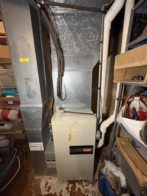 Responded to no heat complaint at residence with 29-year-old Bryant Plus 90 furnace. Diagnostic inspection revealed failed heat exchanger, which presents safety hazard. Provided customer with replacement options for new furnace system. Current unit located in basement utility area with existing ductwork that will accommodate replacement system.