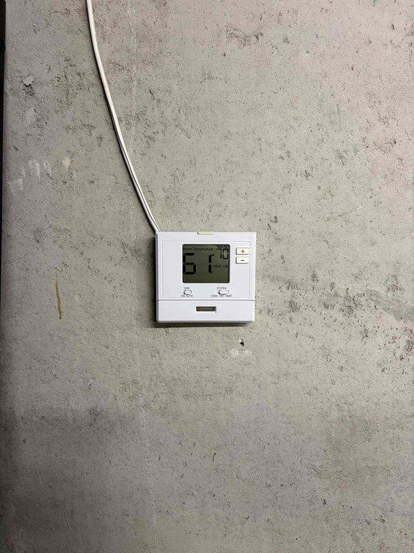 Replaced failed PRO thermostat with new PRO T701 model for boiler system located in customer's bunker area. During service, observed dirty flame sensor and ignitor on NTi Trinity TR85 boiler and performed cleaning to improve operation. Recommended scheduling a complete boiler tune-up to address additional performance issues identified during service.