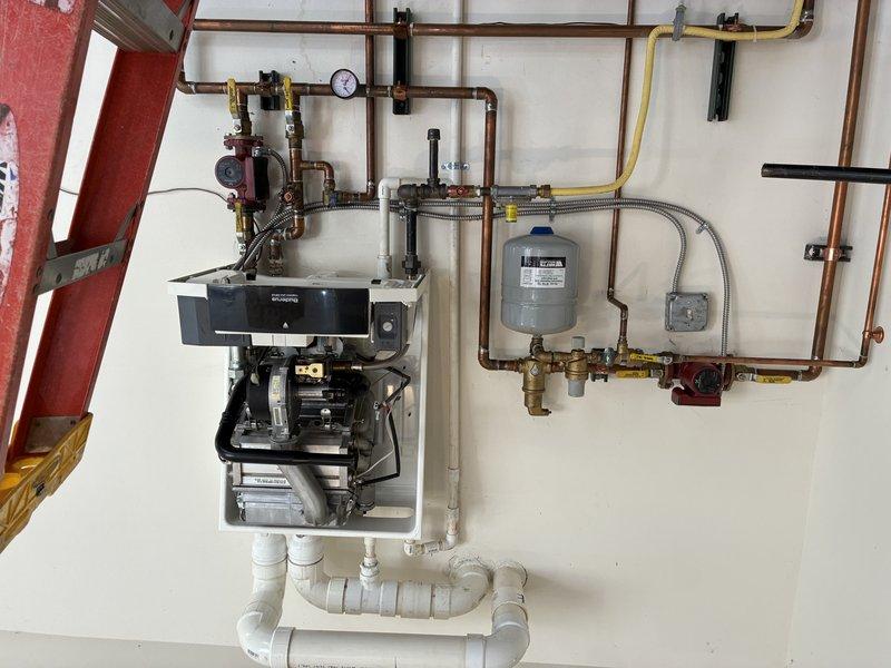 Responded to service call for a Buderus GB142 boiler with 6A error code in detached garage. Discovered wasp nest inside PVC venting which was causing system failure; removed nest and restored operation. Also inspected residential multi-zone boiler system with 11 zones to gather information for future maintenance requirements.