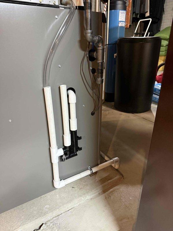 Successfully replaced defective EL297V 70K furnace under warranty with new unit to restore heat. Installed complete system including PVC condensate drainage assembly and properly connected all ductwork and exhaust components. System operational and functioning as designed.