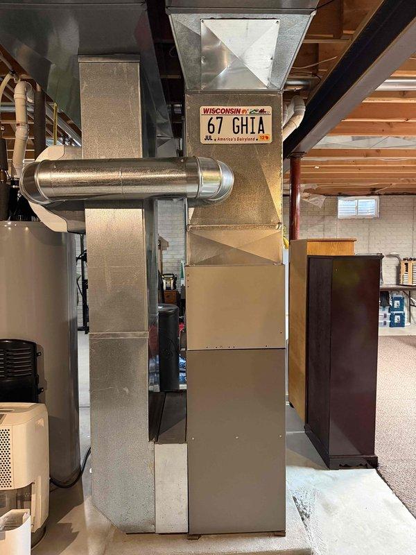 Successfully replaced defective EL297V 70K furnace under warranty with new unit to restore heat. Installed complete system including PVC condensate drainage assembly and properly connected all ductwork and exhaust components. System operational and functioning as designed.
