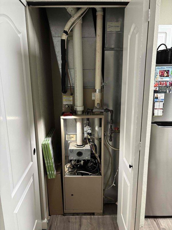 Responded to customer complaint of furnace running continuously without producing heat. Diagnostic inspection revealed failed pressure switches, preventing proper system operation. Visual inspection of furnace installation in utility closet and associated ventilation components confirmed issues. Customer was provided quotation for complete system replacement as repair was not economically viable.