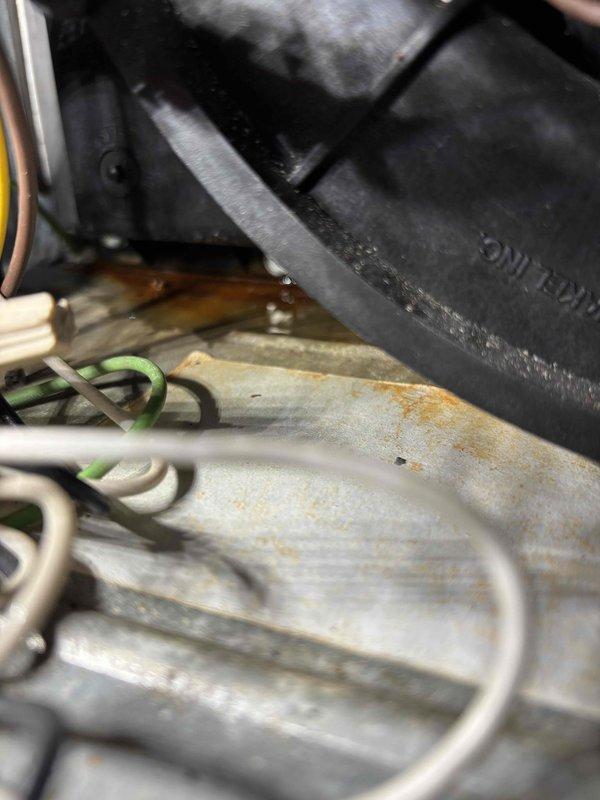 Responded to callback for water presence under furnace following routine maintenance. Visual inspection revealed condensate collector box gasket failure causing water leakage. Documented evidence of corrosion on interior components. Replacement gasket has been ordered to resolve the issue.