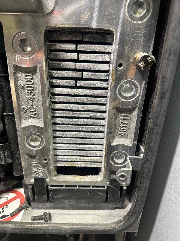 Performed comprehensive deep cleaning maintenance on Bosch boiler system that was heavily contaminated with debris. Serviced heat exchanger using soot saw and brushes to remove accumulated buildup, and replaced critical components including igniter, flame sensor, and gaskets to restore proper operation.