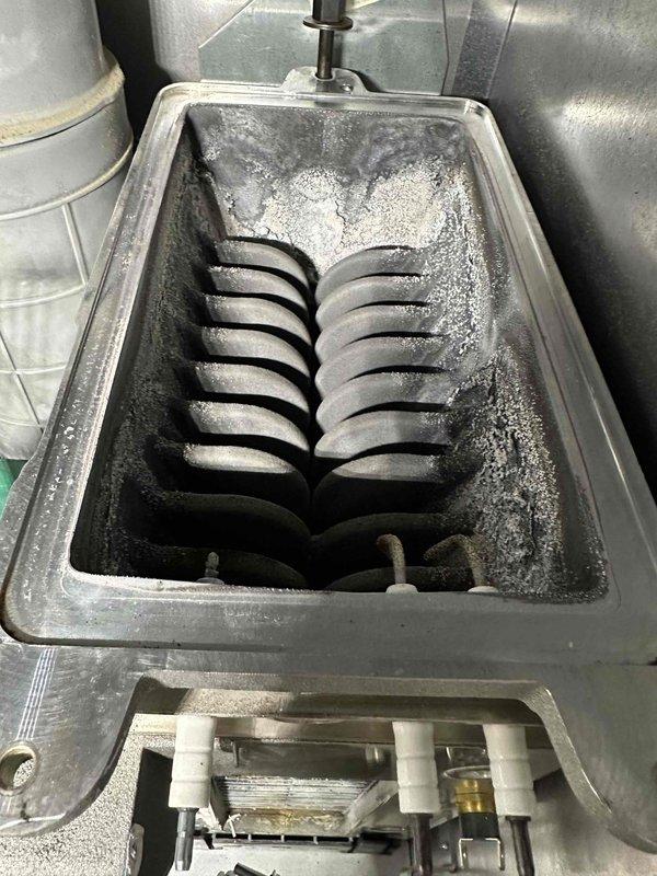 Performed comprehensive deep cleaning maintenance on Bosch boiler system that was heavily contaminated with debris. Serviced heat exchanger using soot saw and brushes to remove accumulated buildup, and replaced critical components including igniter, flame sensor, and gaskets to restore proper operation.