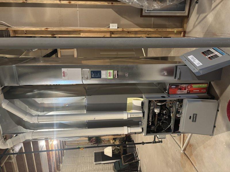 Performed comprehensive furnace tune-up for new customer referred by neighbor. Inspected entire heating system including air handler and tankless water heater installation. Cleaned humidifier and replaced worn humidifier pad to restore proper humidity control function.