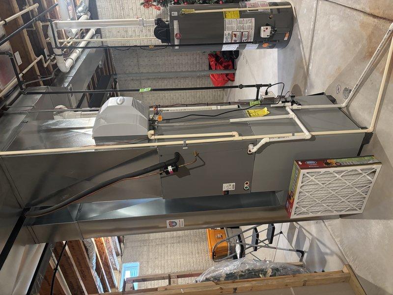 Performed comprehensive furnace tune-up for new customer referred by neighbor. Inspected entire heating system including air handler and tankless water heater installation. Cleaned humidifier and replaced worn humidifier pad to restore proper humidity control function.