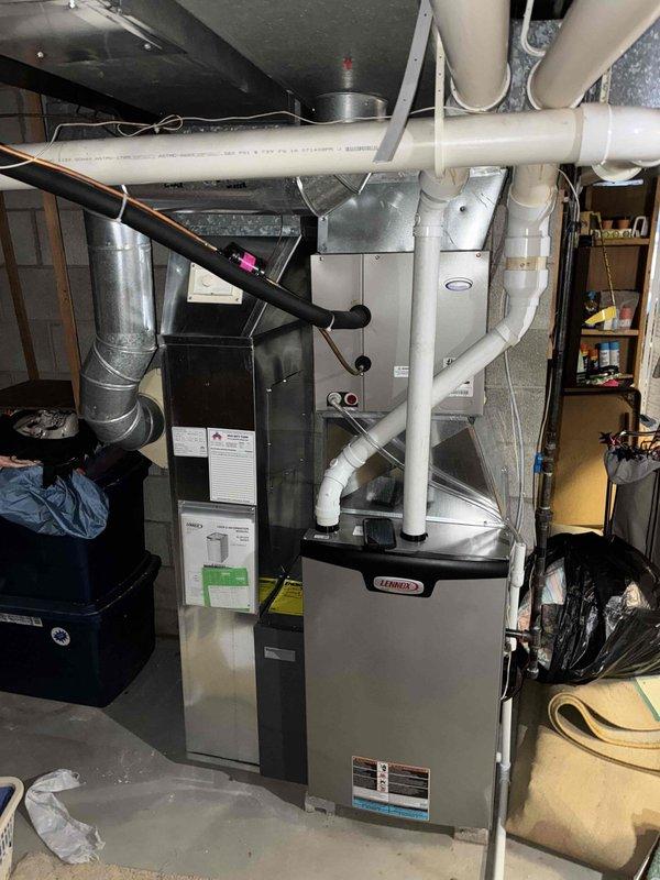 Responded to no heat call for Lennox furnace in utility room. Discovered furnace was tripping on high temperature limit due to customer-installed filter still wrapped in plastic, causing restricted airflow. Removed plastic wrapping from filter, purged excess heat from system by running fan only, then verified proper operation with test heat cycle. System functioning normally upon completion.