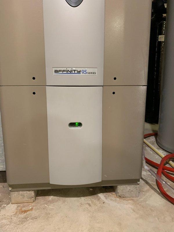 Responded to no heat call for Affinity 9S Series furnace showing green flashing light following power surge. Diagnosed system, performed complete reset of electronic controls, and restored normal operation. Verified proper heating function before completing service.