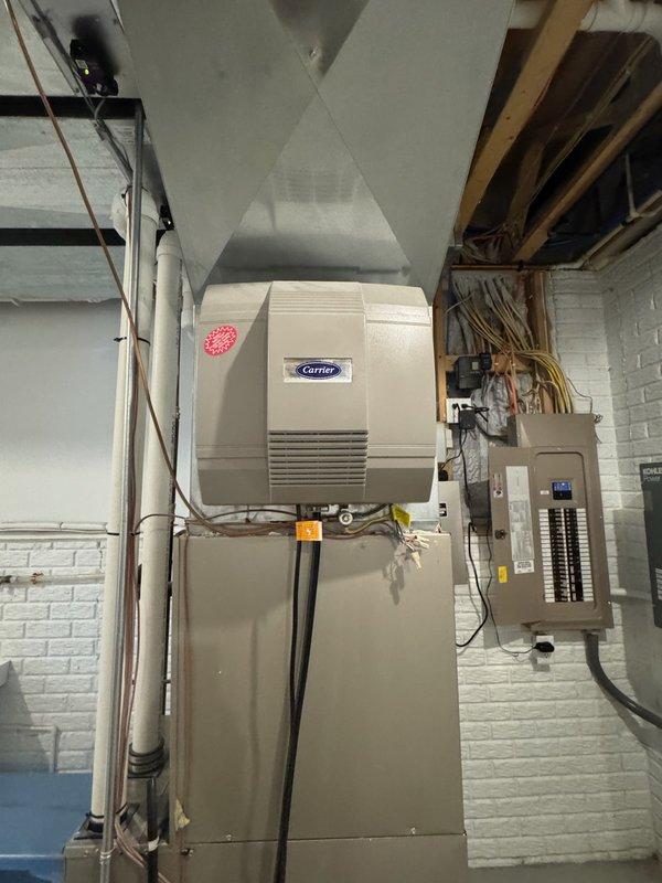 Performed fall preventative maintenance on Carrier furnace system recently acquired by customer. Completed full tune-up service, including system inspection of furnace components, associated ductwork, and humidifier/air treatment unit. Identified and replaced dirty air filter to ensure proper system operation and efficiency for the upcoming heating season.