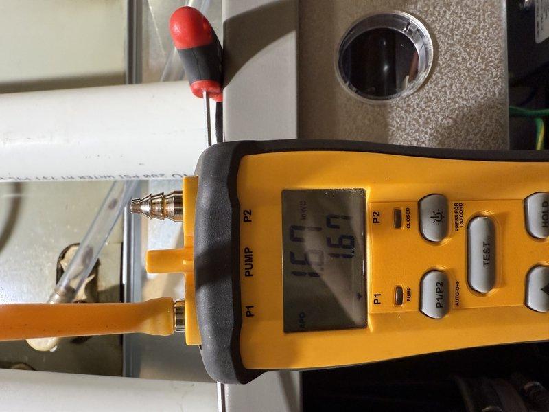 Completed furnace replacement, upgrading from 80% to 90% efficiency model (Lennox EL297E 70K) with new media cabinet. Installed required PVC venting system with dual 18-foot runs positioned tightly along chimney and extended above roofline. Verified proper leveling and system pressure during installation. System is now operational, resolving previous no-heat condition.