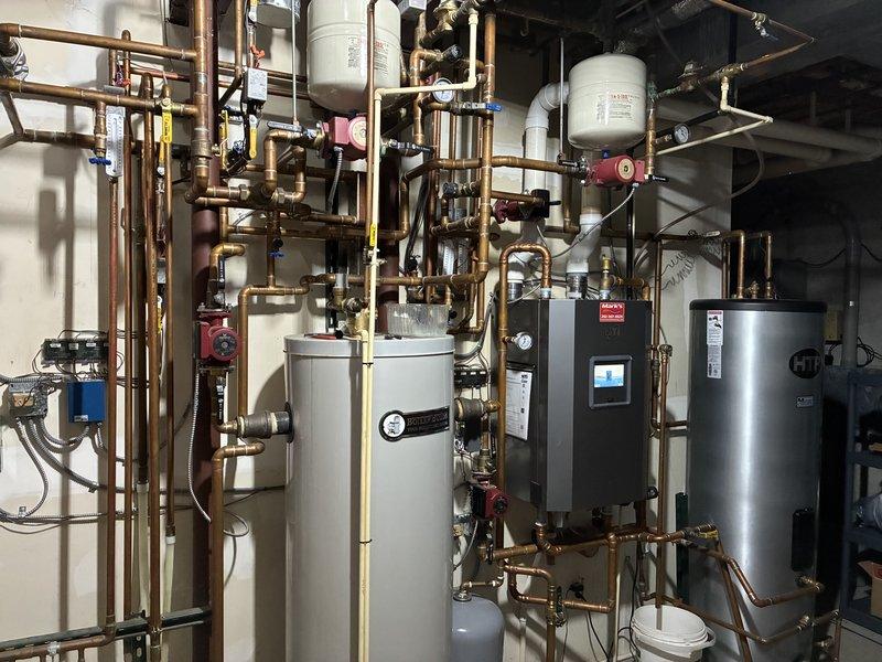 Investigated and isolated leak in a combination hot water and heating boiler system. Inspected the HTP unit, expansion tanks, and complex copper piping network to identify areas of concern. Added isolation valves to strategically separate sections, enabling partial system operation while containing the leak area for future repair in spring.