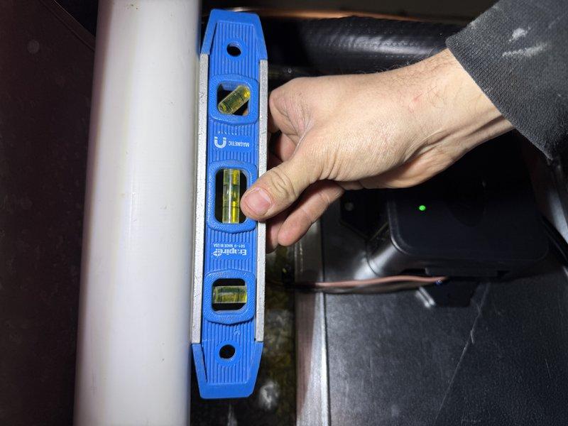 Completed full system installation including EL297E 70K high-efficiency furnace, ML13KC1 2-ton air conditioner, and 24B-71 cased coil. Replaced 20ft lineset, installed new drop and media filter, and added support bricks under furnace to replace existing slab. Converted from 80% to 90% efficiency requiring new PVC back-venting with approximately 12ft per run. Upgraded gas piping, replaced broken brass gas valve, and repositioned furnace orientation as specified. Removed inoperative dehumidifier and humidistat during installation.