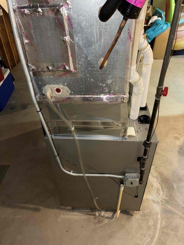 Responded to after-hours no heat call for a furnace showing error code 31. Diagnosed obstruction in exhaust motor drain ports causing water backup into motor housing and pressure switch ports, preventing proper operation. Performed thorough drainage and cleaning of affected components, restoring normal system function and heat output.