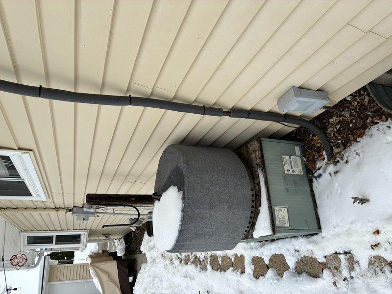 Performed assessment of existing R22 air conditioning system for potential replacement. Inspected outdoor condenser unit and attic-mounted air handler. System is currently functional but nearing end of lifecycle due to R22 refrigerant phase-out. Collected specifications and measurements for proper equipment sizing and replacement options.