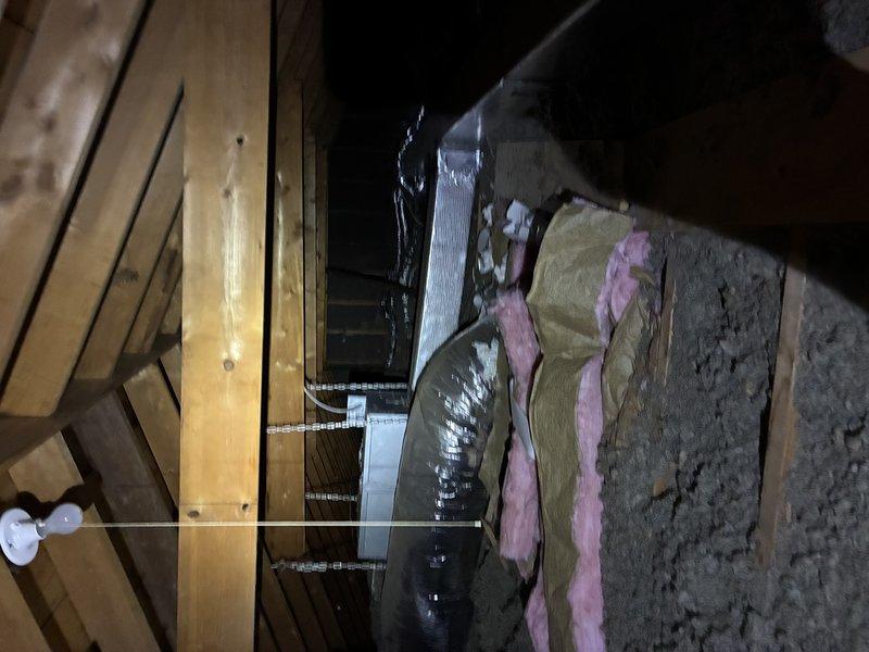 Performed assessment of existing R22 air conditioning system for potential replacement. Inspected outdoor condenser unit and attic-mounted air handler. System is currently functional but nearing end of lifecycle due to R22 refrigerant phase-out. Collected specifications and measurements for proper equipment sizing and replacement options.