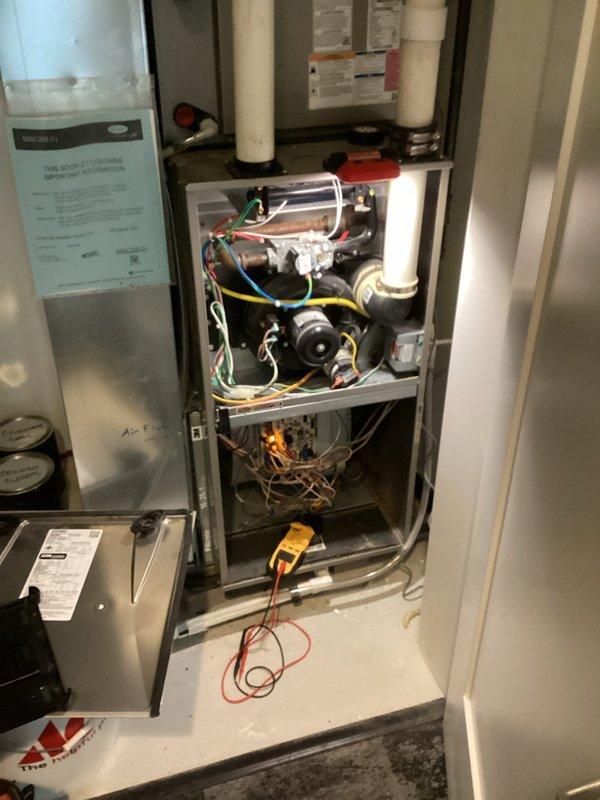 Responded to no heat service call for aging system with blank thermostat. Upon arrival, determined breaker had tripped and reset it. Performed diagnostic testing with multimeter, recording voltage readings of 61.50V across internal components. Completed full inspection of furnace interior, checking wiring connections and mechanical components. System operated normally during test run after breaker reset. Informed homeowner situation may have been caused by coincidental electrical issue with Christmas lights. All system functions verified operational at departure; customer advised to monitor for any recurrence.