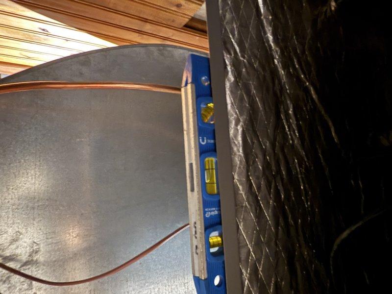 Successfully completed installation of a complete HVAC system including an SLP99 70K BTU furnace, EL18KCV 2-ton condensing unit, 24B-71 cased coil, and S40 thermostat. Ran approximately 35 feet of new lineset with special attention to fishing it through 5 feet of finished ceiling area, replaced PVC venting (2-inch, non-cellular core), and properly leveled all equipment while reusing existing media and cold air return.