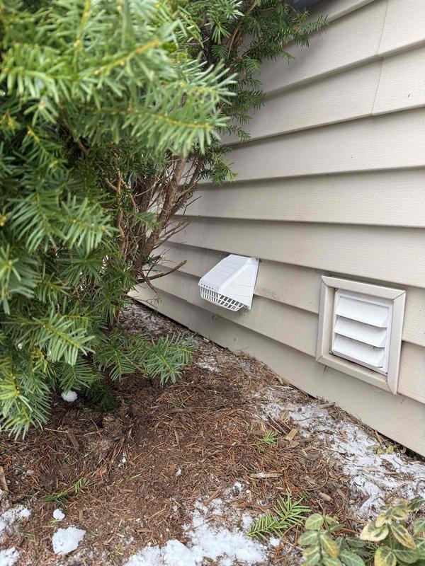 Completed installation of 5 new supply runs to basement area with two registers per bedroom and one in open area. Installed 2 low return grilles (one per bedroom) and vented existing exhaust fan. All ductwork was properly connected to existing HVAC system with metal components secured through exposed framing, and exterior ventilation was completed with proper wall penetration and vent cover installation.