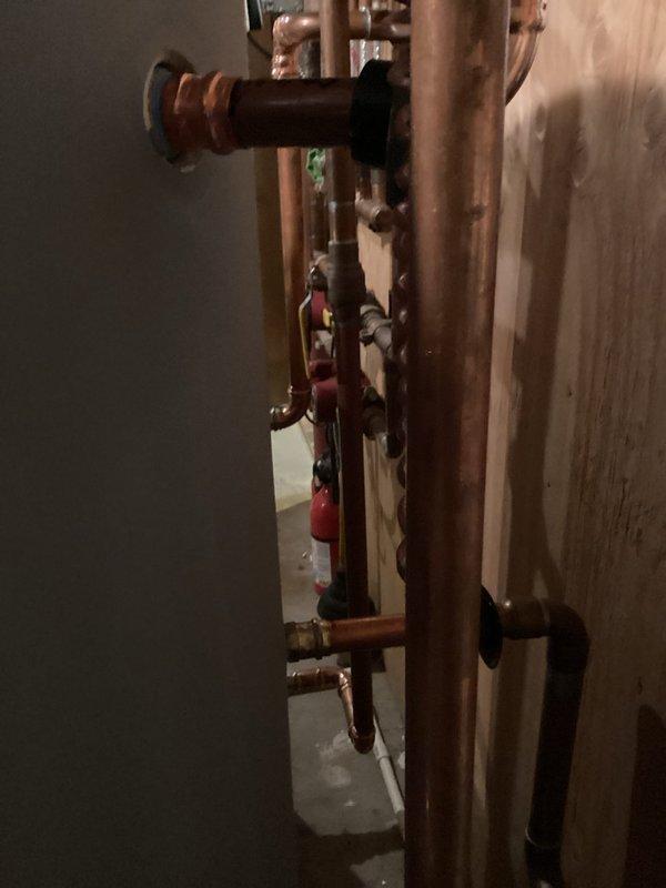 Responded to warranty service call for an indirect water heater tank that continues to leak after installation six months ago. Inspected copper piping infrastructure and connections to identify leak source. Initiated warranty replacement process for the defective tank per manufacturer guidelines.