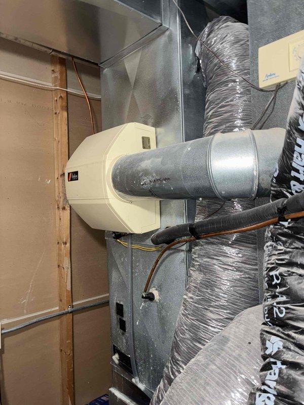 Diagnosed intermittent high-pitched whistling noise from customer's furnace, identified sticking zone dampers as root cause. Demonstrated manual zone damper operation to customer and provided quote for complete zone system replacement.