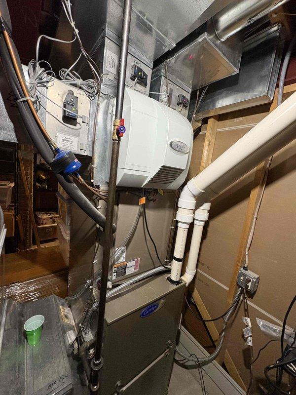 Performed annual furnace maintenance on Carrier unit under RS4US Quality Plan. Completed comprehensive furnace tune-up with all systems operating properly. Serviced humidifier including cleaning and filter replacement, and installed new 20x25x4 air filter.