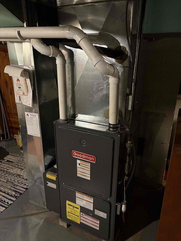 Installed new Honeywell T6 digital thermostat in customer residence, replacing previous unit. Confirmed proper connection to existing Goodman furnace system with verification of heating function (current reading 66°F, set point 70°F). System operating normally with all ductwork connections intact.