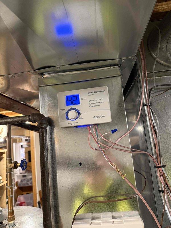Successfully installed an Aprilaire 700 whole-home humidifier system on the existing HVAC unit. Mounted the humidifier to the ductwork, connected the necessary water supply lines, and installed the digital humidifier control panel with appropriate wiring. System was tested and is functioning properly.
