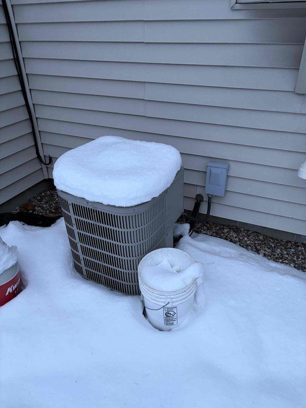 Responded to a no-heat call for a residence with a 10+ year old heating system. Diagnostic inspection revealed a failed heat exchanger, rendering the furnace unsafe for operation. Provided customer with replacement options and quotes for a new furnace system. Photos documented the current installation environment including basement mechanical space and snow-covered outdoor condensing unit.